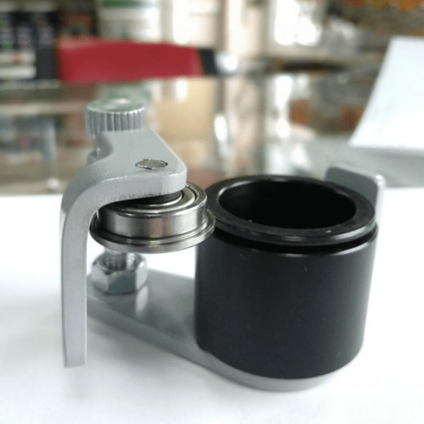 Укупорювач контрольного кільця для ковпачків з різьбою